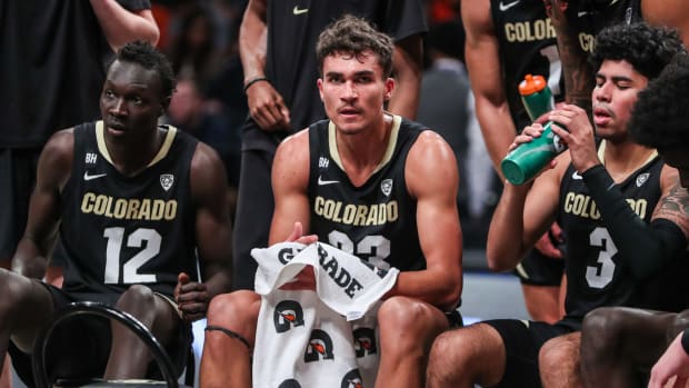 Dec 10, 2023; Brooklyn, New York, USA; Colorado Buffaloes forwards Bangot Dak (12), Tristan da Silva (23) and guard Julian Hammond III (3) at Barclays Center